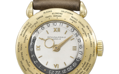 PATEK PHILIPPE. A VERY RARE AND ATTRACTIVE 18K GOLD WORLD...