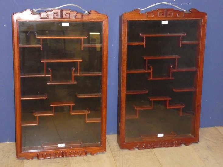 Pair of Chinese snuff bottle cabinets with extensive shelvin...