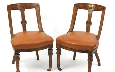 Pair of Victorian oak chairs with brown leather seats