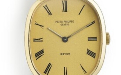 Patek Philippe A wristwatch of 18k gold. Model Ellipse, ref. 3548. Mechanical movement with manual winding, cal. 23 300. Champagne-coloured dial with black hour markers and gold hands. Dial co-signed Beyer. Black strap with Ellipse shaped buckle...