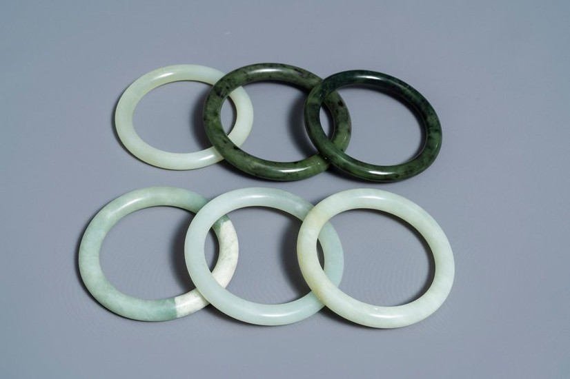 Six Chinese celadon and spinach green jade bangles…
