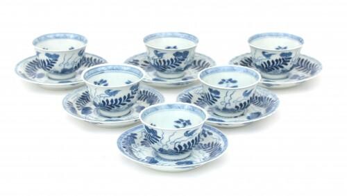 Six Chinese porcelain cups and saucers decorated with stylized flower, leaf-motifs and birds, 19th century.