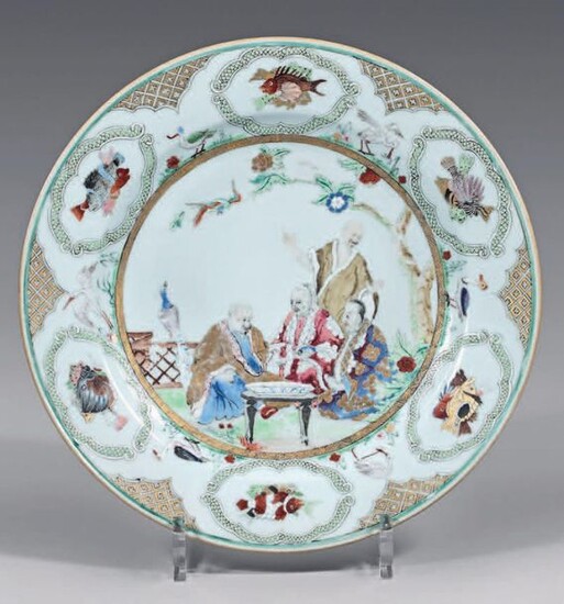 Small porcelain dish. Qianlong, 18th century, circa 1736-1740, decorated with enamels of the Rose Family, in the center of many figures in a landscape in a gold medallion, the wing with fish and various animals in interspersed green cartouches, green...