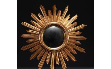 Sun mirror in gilded resin, circa 1960/70.