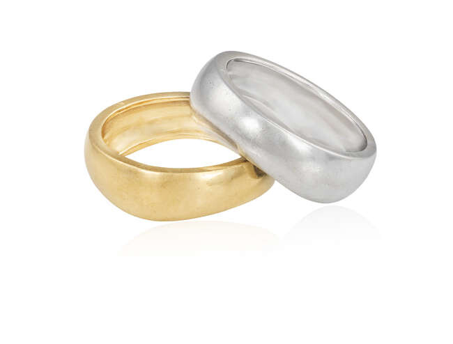 TWO GOLD RINGS, BY CARTIER Each wavy polished...