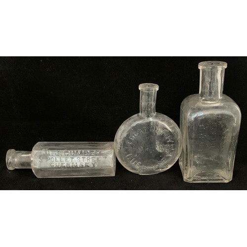 Three scarce Guernsey clear glass Chemist's bottles, H.J.Cum...