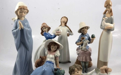 Two LLadro and five Nao figurines.