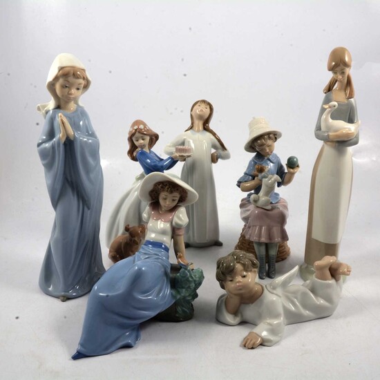 Two LLadro and five Nao figurines.