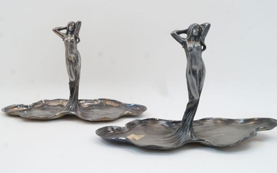 Two WMF Art Nouveau figural pewter dishes, 20th century, each designed as a maiden emerging from a twin leaf lily pad, with marks to underside, each 21cm high (2)