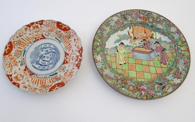 Two oriental plates, one decorated with flowers