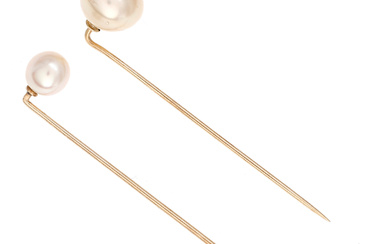Two tie pins with pearls.