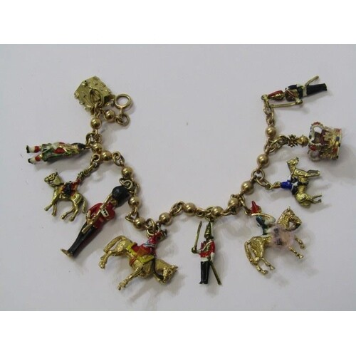UNUSUAL 9ct YELLOW GOLD CHANGING OF THE GUARD CHARM BRACELET...