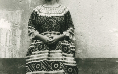 Untitled (Frida Kahlo standing against concrete wall)
