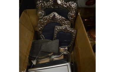 Various silver and other photograph frames.