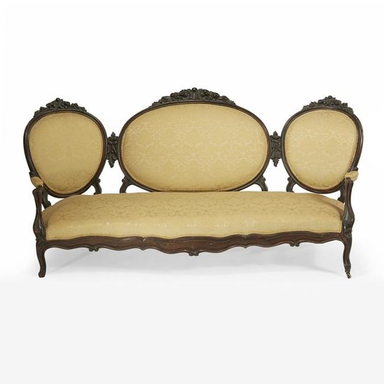 Victorian rococo revival carved mahogany sofa, circa