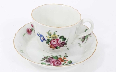 Worcester faceted coffee cup and saucer, circa 1770, polychrome painted with flowers