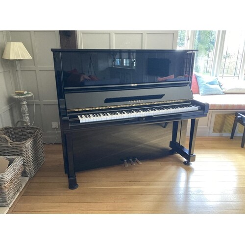 Yamaha (c1985) A Model U3 upright piano in a bright ebonised...