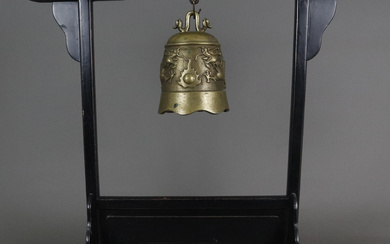 bell with dragon relief in wooden frame - China.