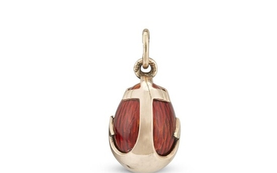A Fabergé gold and strawberry red enamel miniature egg...