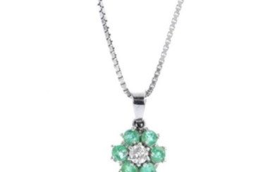 An emerald and diamond pendant. The brilliant-cut