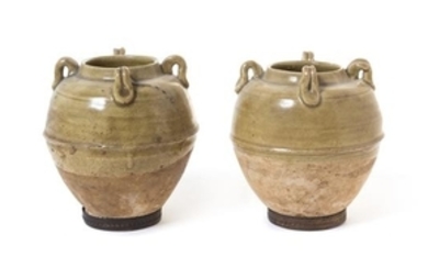 * A Pair of Green Glazed Pottery Jars
