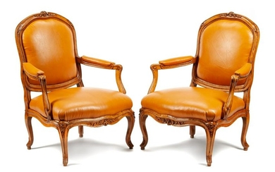 A Pair of Louis XV Leather Upholstered Beechwood