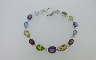 A modern multi gem set bracelet