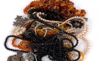 A quantity of costume jewellery including amber bead