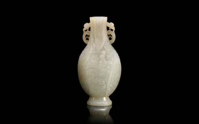 A small grey jade archaistic vase and a pair of spinach green figures
