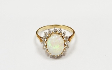 18ct gold, opal and diamond cluster ring, the oval opal surr...
