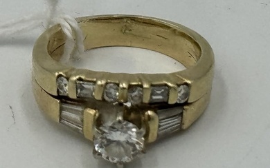 A 14K GOLD AND DIAMOND WEDDING RING, 6.41 GRAMS. SIZE 6.5