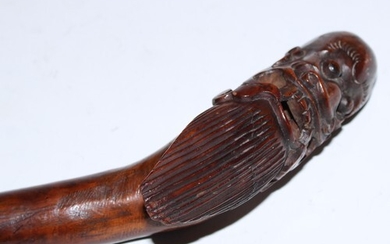 A 19th century Chinese rootwood walking stick, the pommel ca...