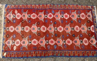 A 20TH CENTURY PERSIAN DESIGN RUG, rust ground with