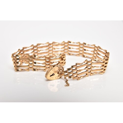 A 9CT GOLD GATE BRACELET, approximate width 6.6mm, fitted wi...