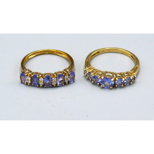 A 9ct. Gold Band Ring set five tanzanite interspaced with di...