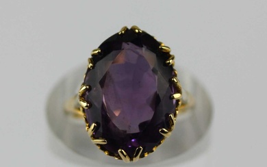 A 9ct gold and purple gem set ring