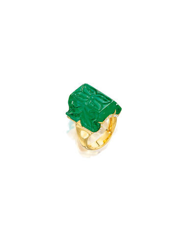 A CARVED EMERALD AND DIAMOND RING