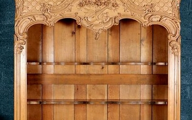 A CARVED PINE OVERSIZED OPEN BOOKCASE