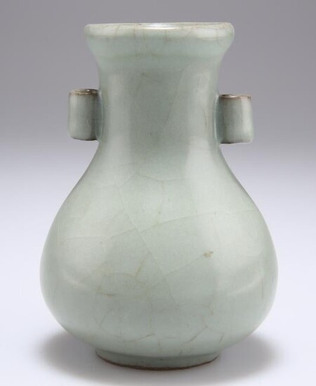 A CHINESE CELADON VASE, bottle shaped porcelain with