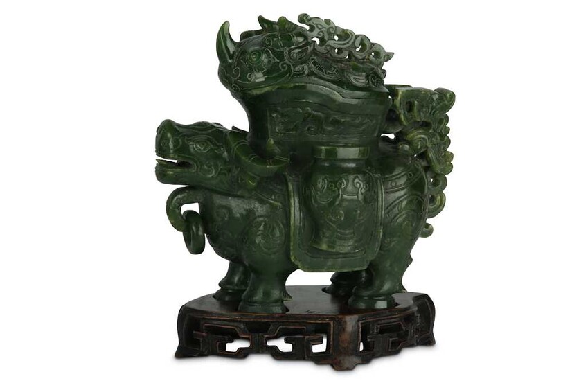 A CHINESE SPINACH-GREEN JADE ‘BULL’ VESSEL AND COVER, ZUN....