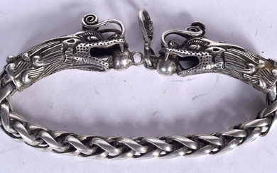 A CHINESE WHITE METAL BRACELET, formed as opposing