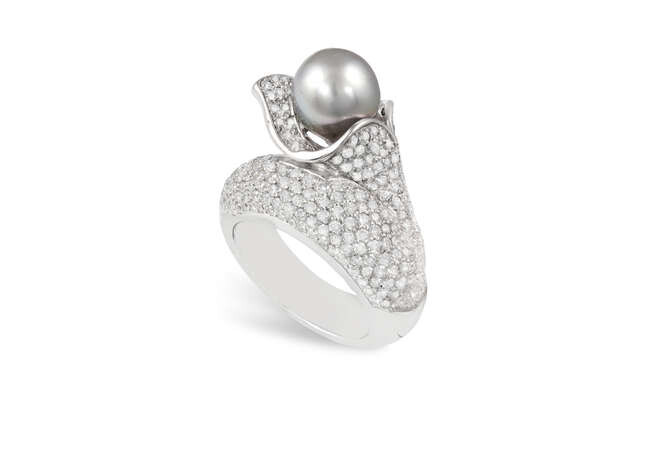 A CULTURED PEARL AND DIAMOND DRESS RING Designed...