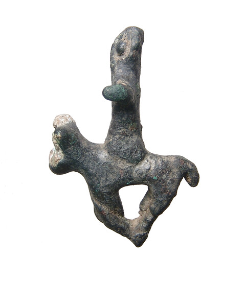 A Canaanite bronze figure of a bull and rider