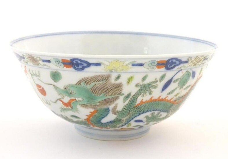 A Chinese bowl with dragon and flaming pearl detail