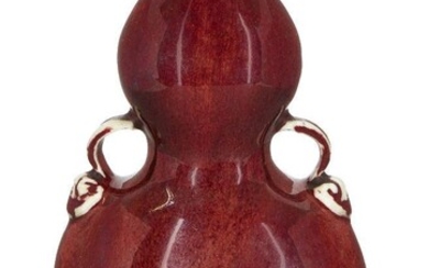 A Chinese monochrome porcelain copper-red double-gourd vase, huluping, 19th century, of flattened form with moulded loop handles, 18.3cm high