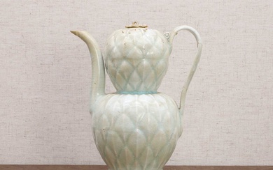 A Chinese qingbai ware ewer and cover