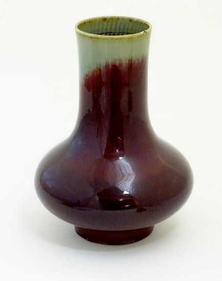 A Chinese sang de boeuf two tone vase with a crackle