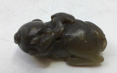 A Chinese spinach jade carved recumbent beast