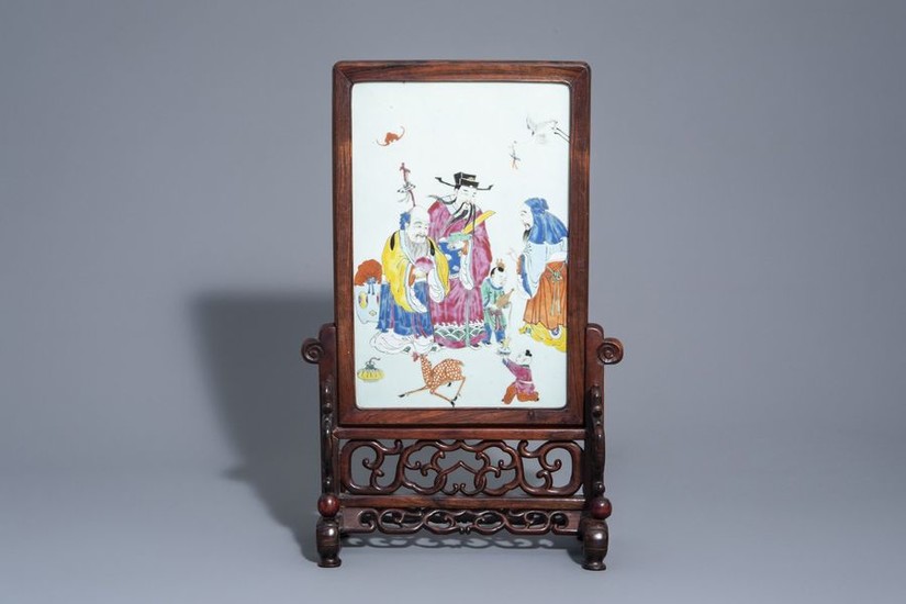 A Chinese wooden table screen with a famille...