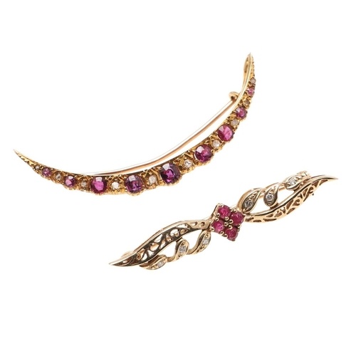 A DIAMOND AND RUBY OPEN CRESCENT BROOCH. mounted with circul...